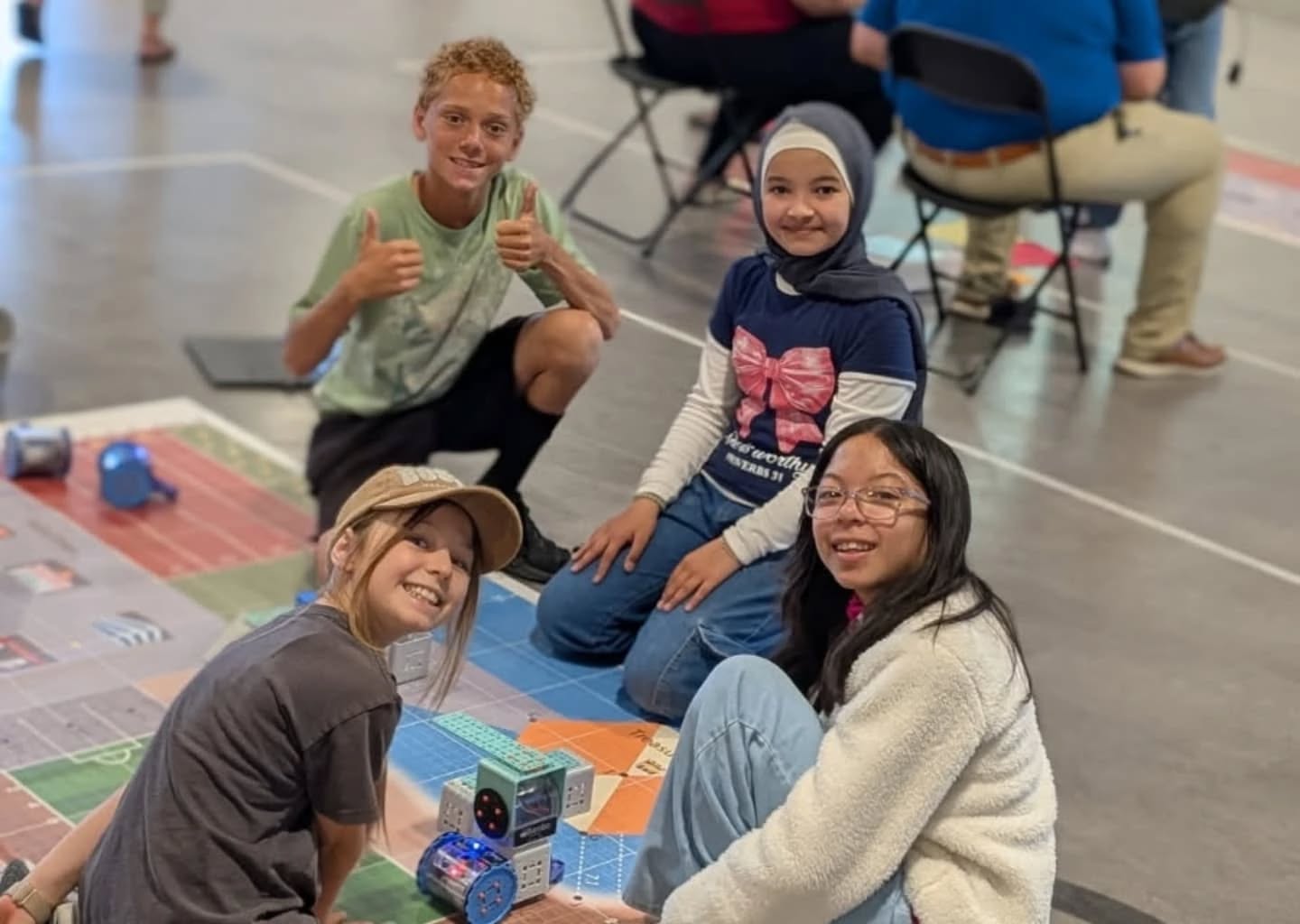 students gather around a RoboPlay mat