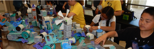 Image of students engaging in a RoboBlockly activity.