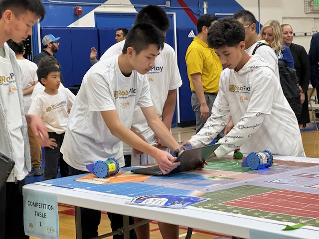 students programming a robot