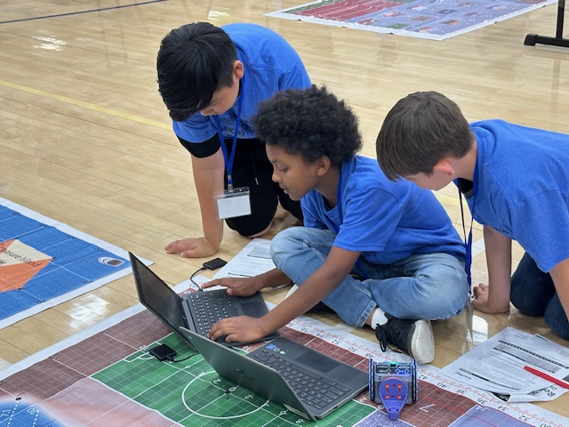 students programming a robot