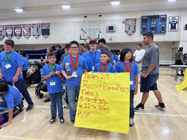 students holding up a sign