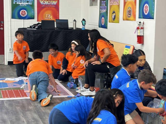 students sitting on the RoboPlay mats