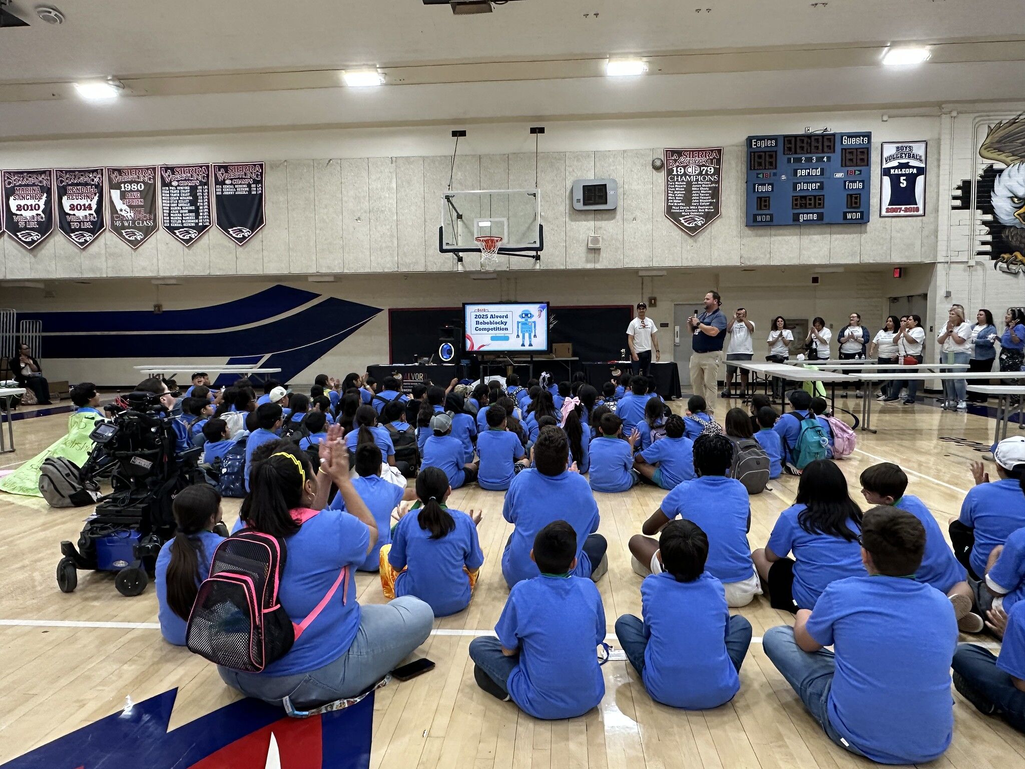 a group of student sitting and listening to challenge instructions