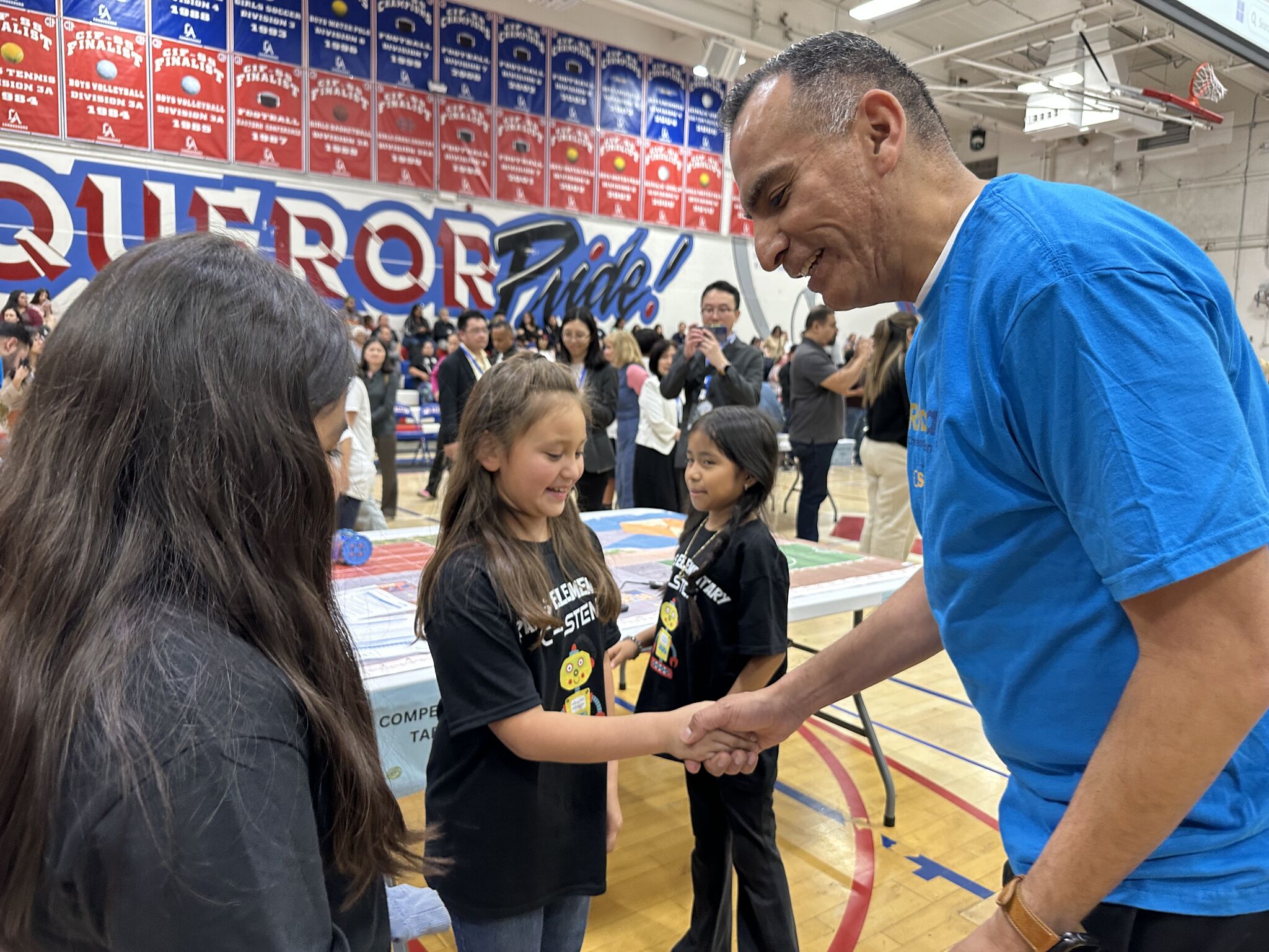 student shakes hand with judges