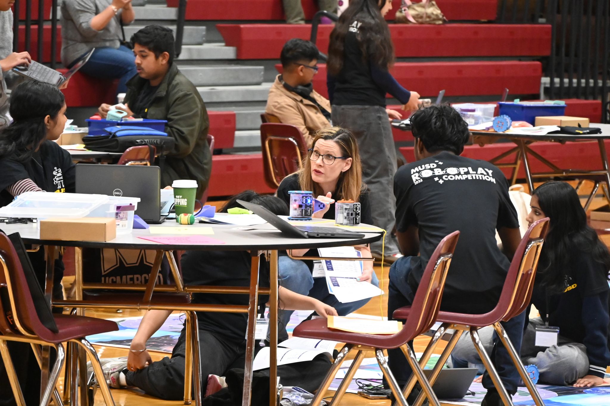 students receive feedback from a judge