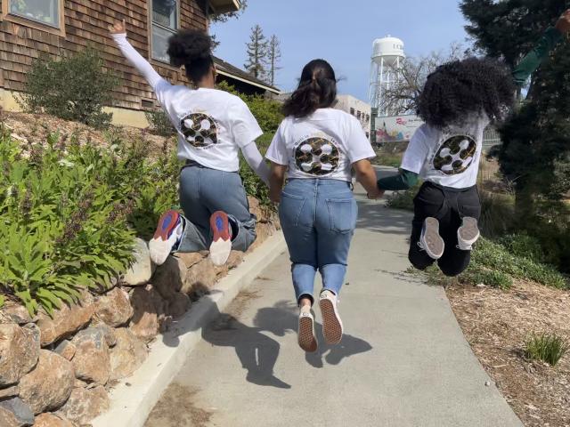 Ujima Student Assistants jumping