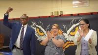 man and 2 woman pumping fists in the air and clapping